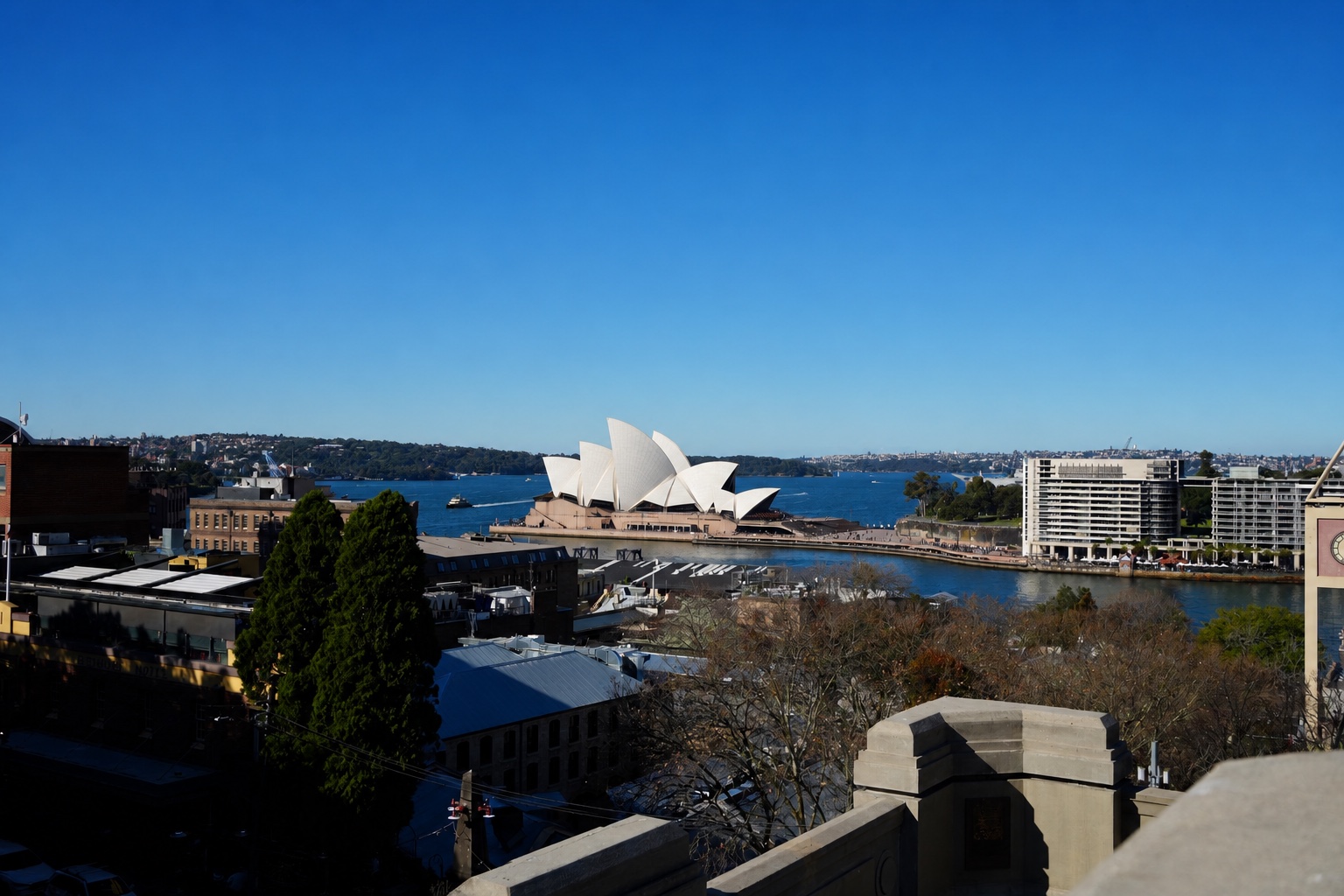Sydney Opera House and Sydney Harbour Bridge silhouetted at sunset